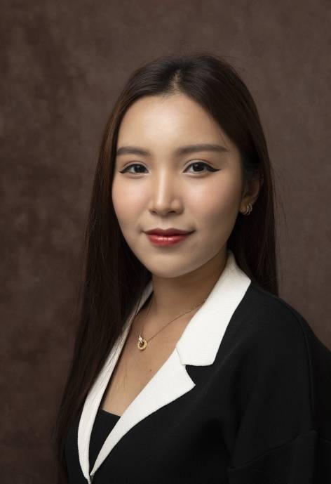 Anh Huynh wearing a black and white jacket.