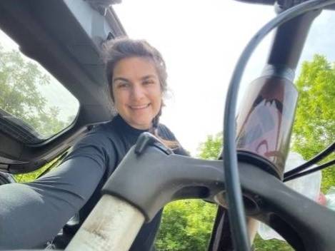 Emma taking a selfie with her mountain bike.