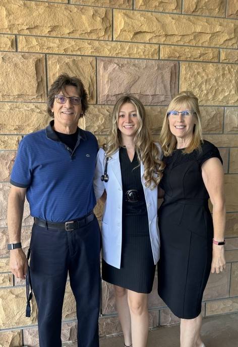 Anna with her parents.
