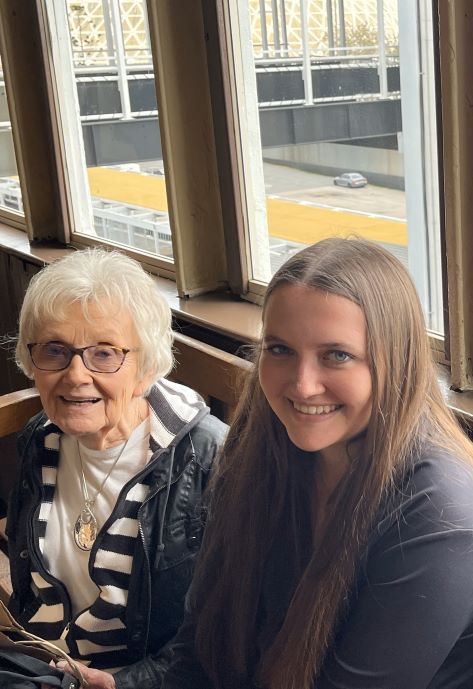 Makena sitting with her grandmother.