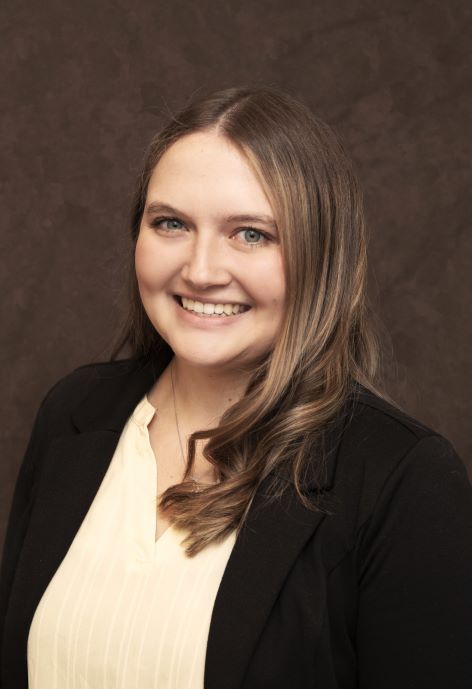 Makena Engelker wearing a black jacket and a cream colored blouse.