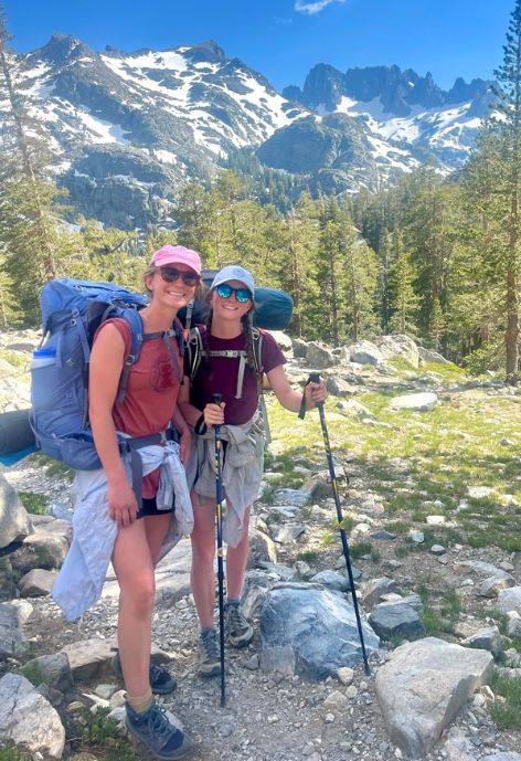 Maggie hiking with a friend.