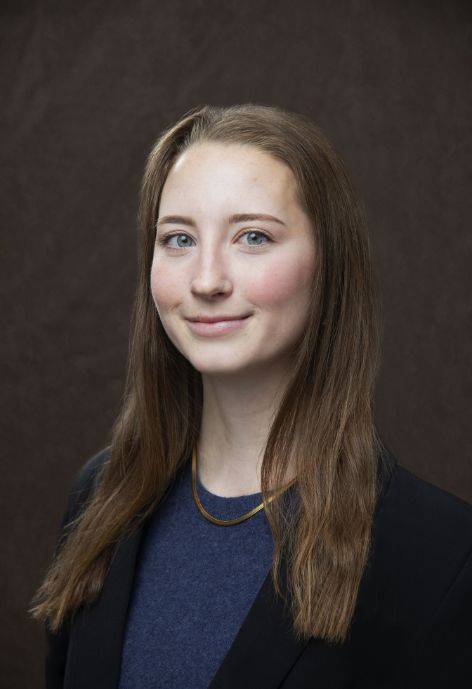 Margaret Kuehl wearing a black jacket and a blue sweater.