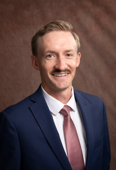 jarom davidson wearing a navy suit and tie