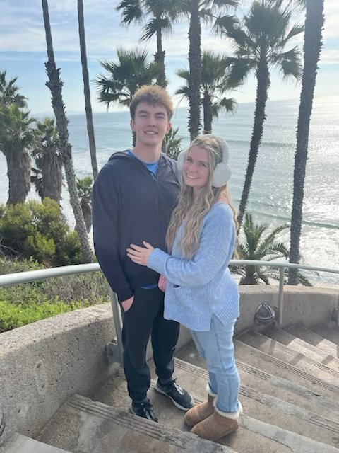 porter on the beach with his wife