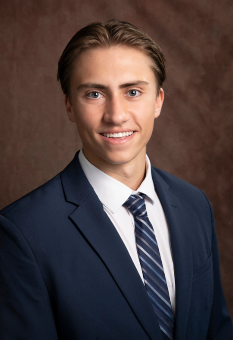 braden wearing a suit and tie