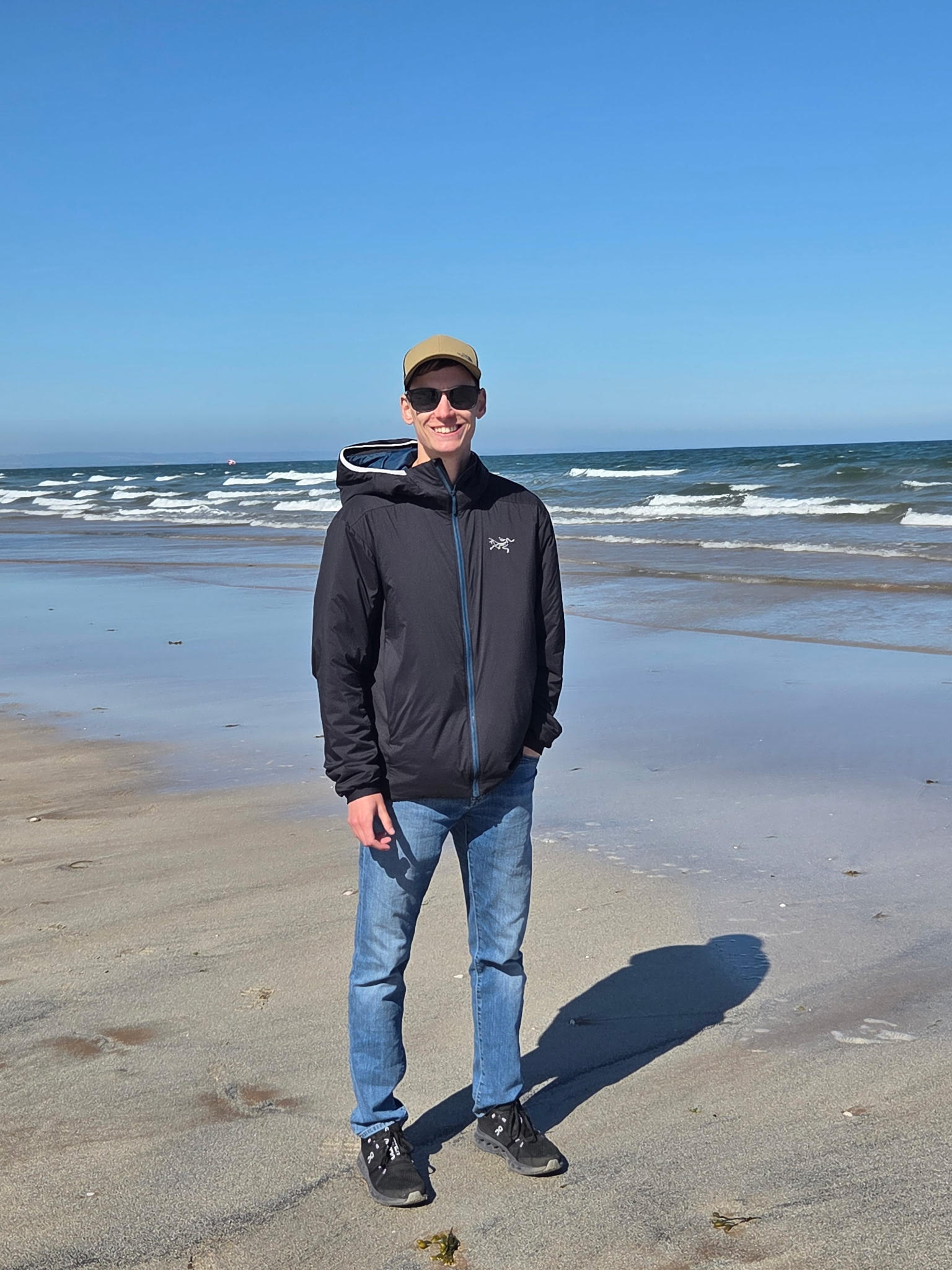 cole smiling on a beach