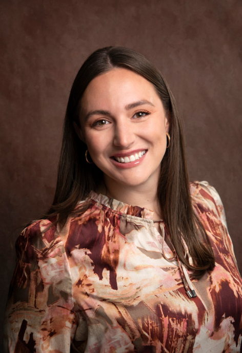 alexis in a floral blouse