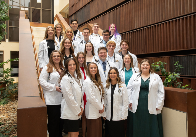 Medical students standing on staircase