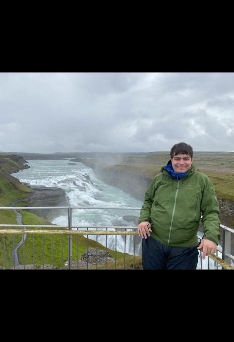 Dalton next to a waterfall