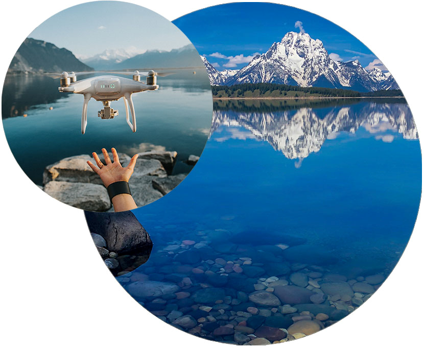 A image of a drone and a lake with mountains in the background.