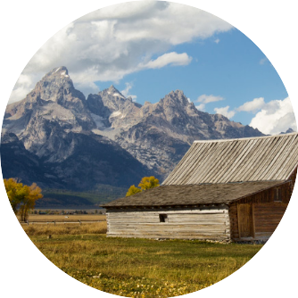 Old barn with the Teton mountains in the background.
