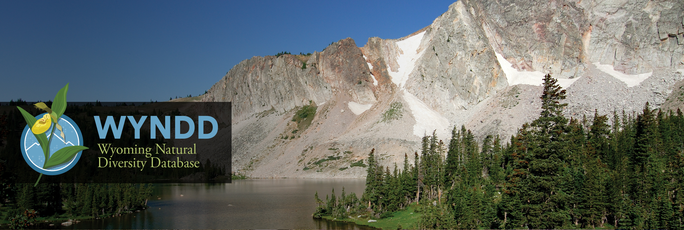 WYNDD (Wyoming Natural Diversity Database) logo over mountain landscape