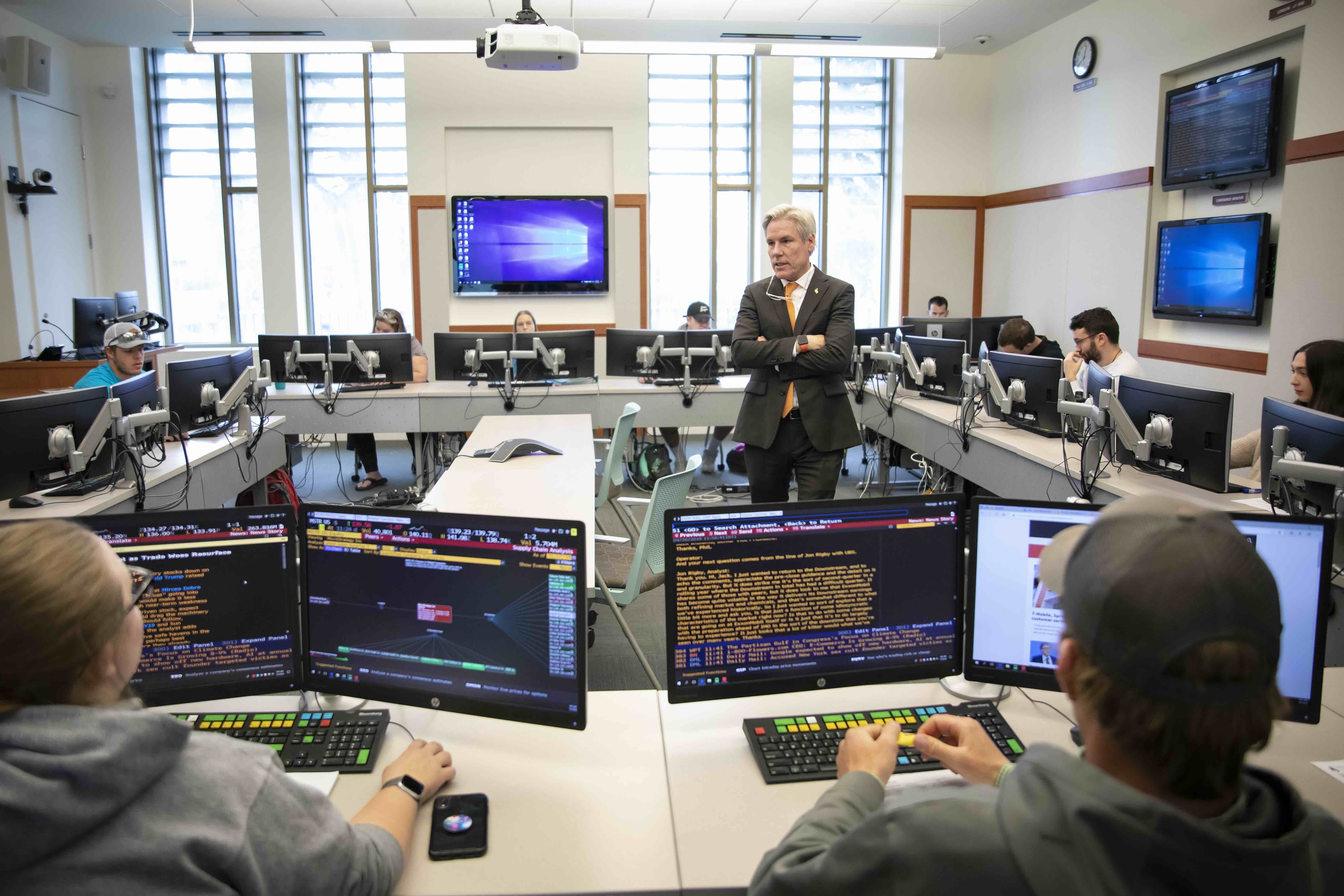 Photo of an instructor in a classroom.