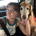 Addie Crnich posing with a dog