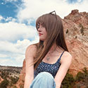 Amanda Sinnott sitting among rock formations