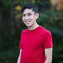 Jacob Vann outside with greenery in the background