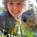 Josie Walton posing outdoors with a marmot