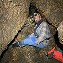 Photo of Braden Mays in a cave