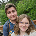 Steven Poyer and friend on a bridge over a stream