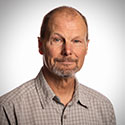 Scott Seville headshot on gray background