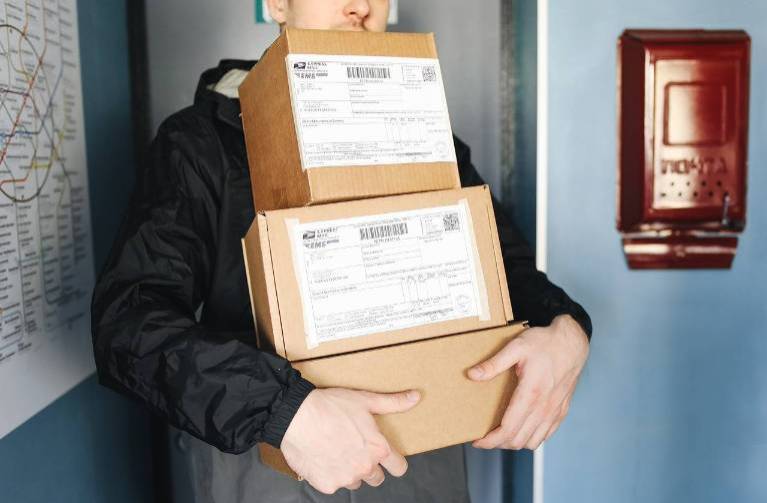 man holding packages