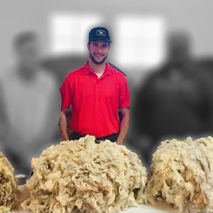Dallin Brady judging wool fleeces