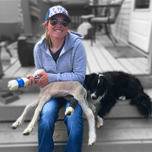 Lexi Springer feeding a baby lamb