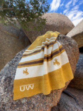 Wool blanket draped boulder
