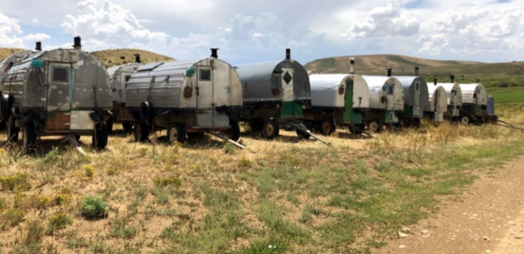 Sheep wagons in a field