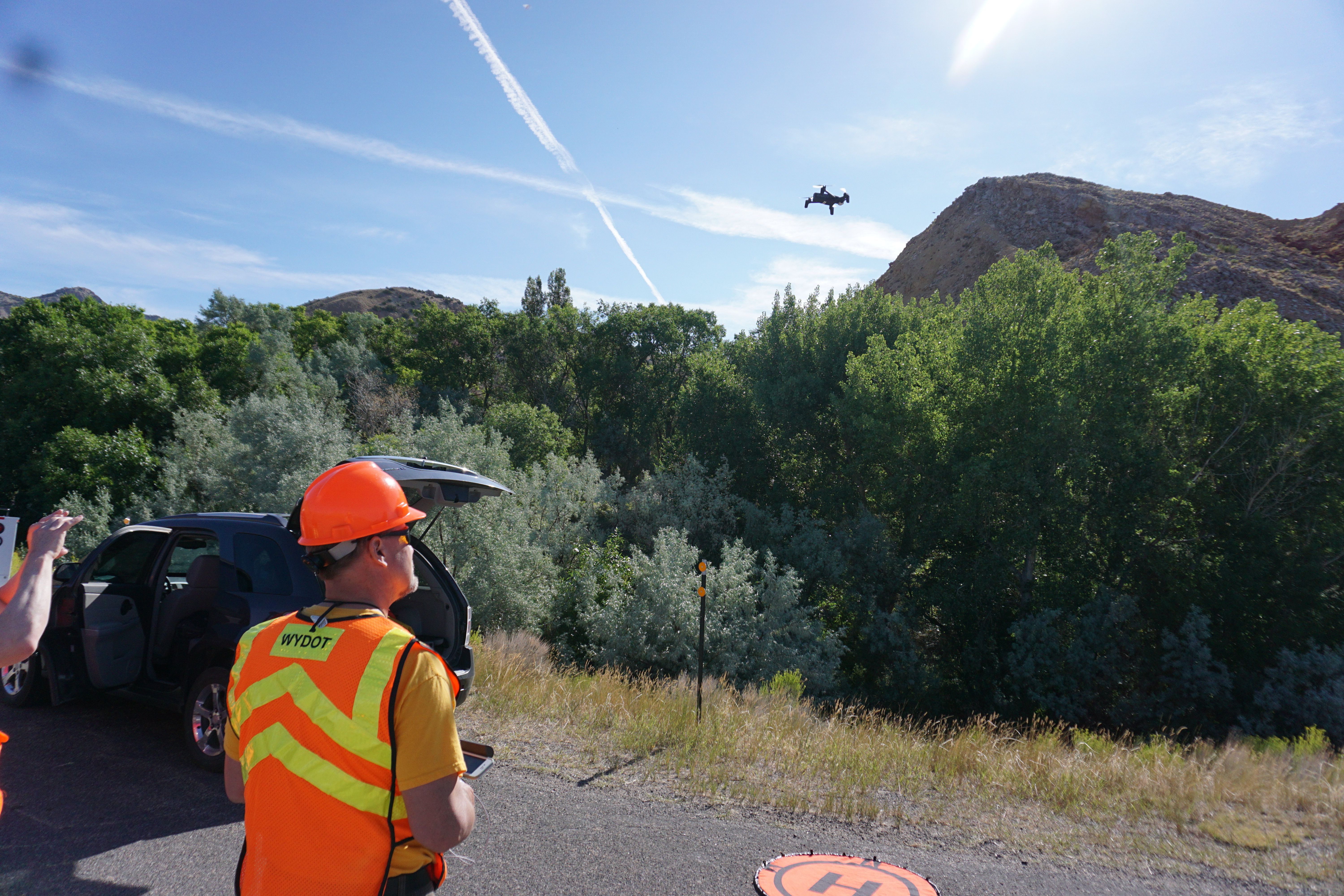 Road worker operating a Drone