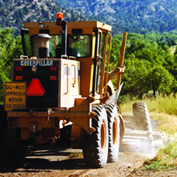 Tractor road-leveling